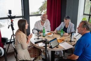 Tricia Veldman gets sage advice for growing her company Powerful & Poised from Dhiru Thadani and Prudence Farrow Bruns, with host Fletcher Isacks over lunch at Farm & Fire restaurant