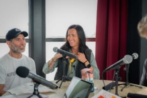 Brandon and Jennifer Favano - and their money, Tiki, making his way into Jennifer's shirt. Jennifer and Brandon are known collectively as "That Kiteboard Couple," promting the kiting lifestyle on the water and on siocial media from their perch in Navarre. Tkiki the monkey has been their key to social media success